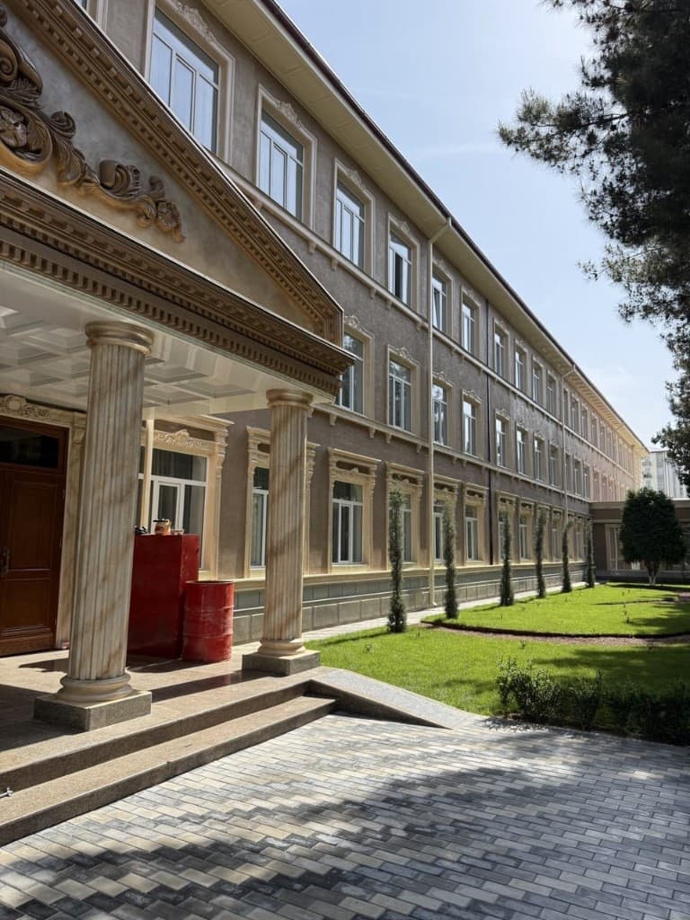 FMIPH academic block building and landscaped campus area