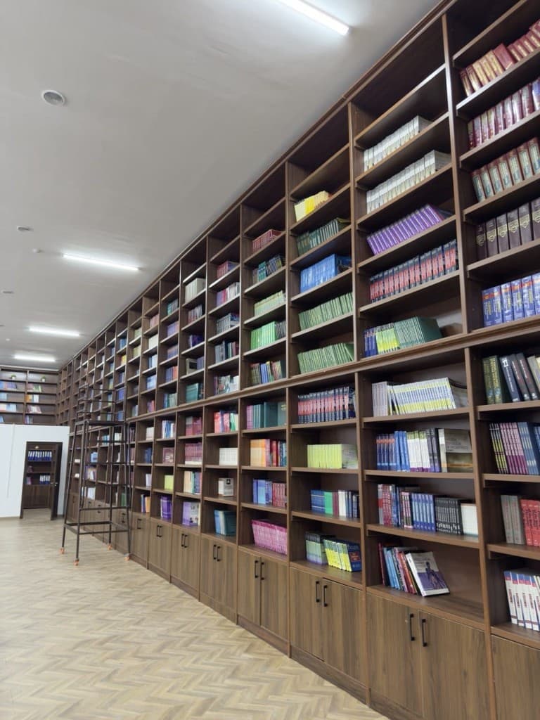 FMIPH library shelves with academic and medical reference books